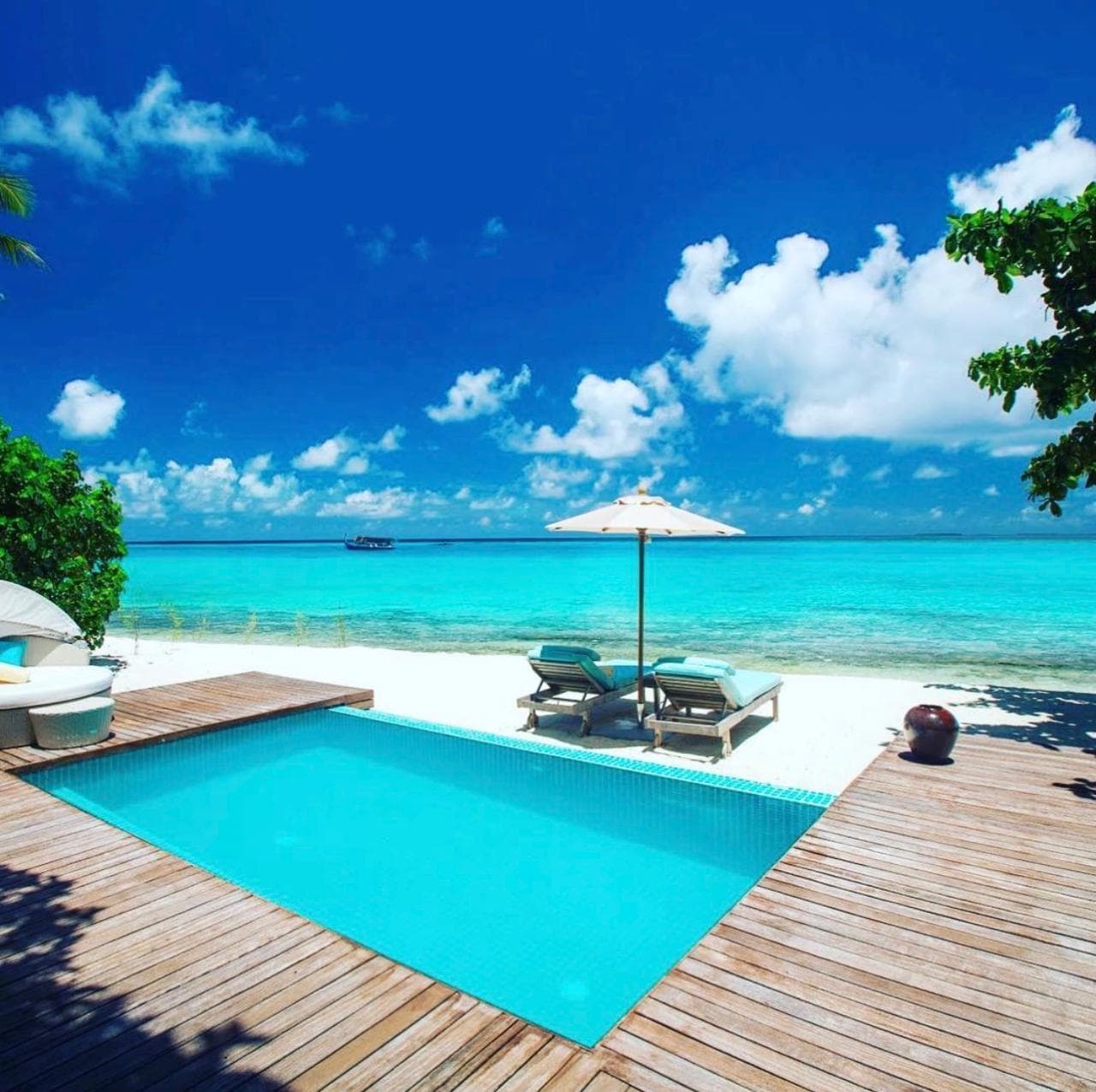 A beach villa pool at Loama Resort Maldives looking out to the lagoon
